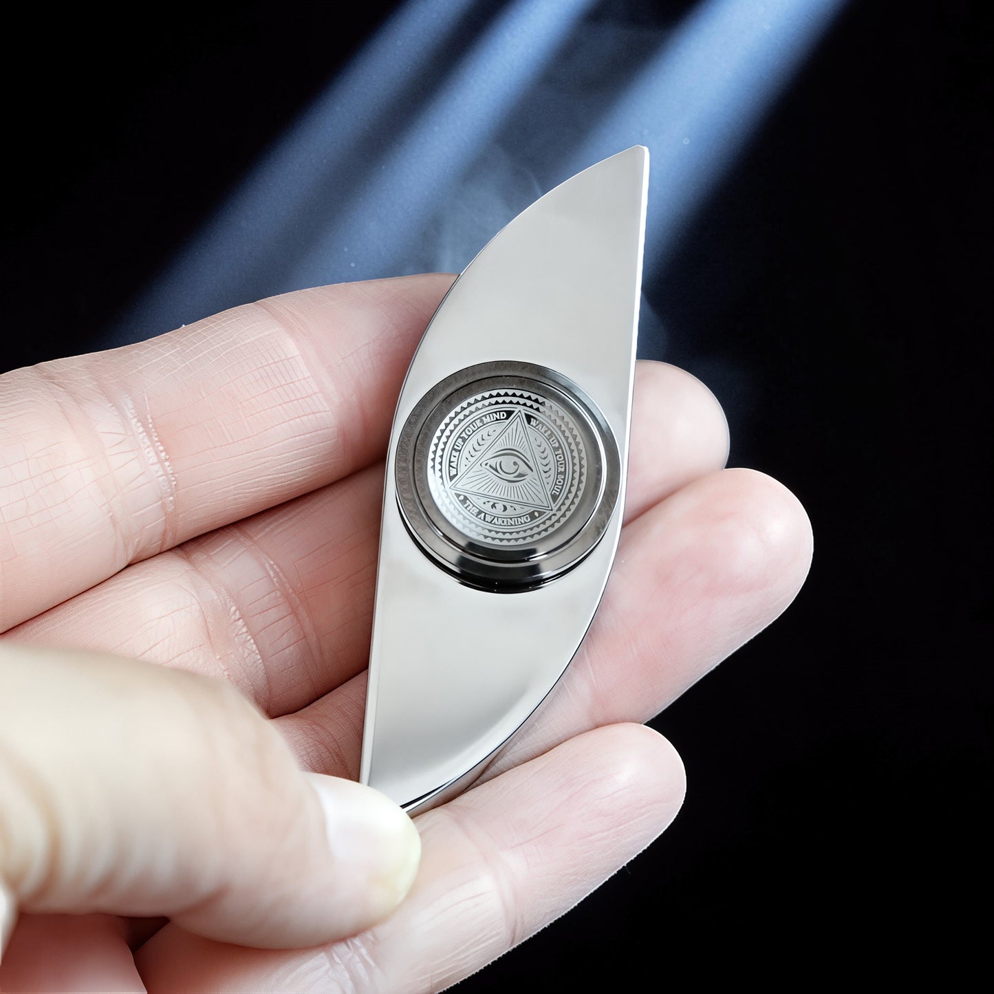 The Curious Mind Power Eye Sensory Spinner, a premium silver metal fidget spinner with an all-seeing eye design.