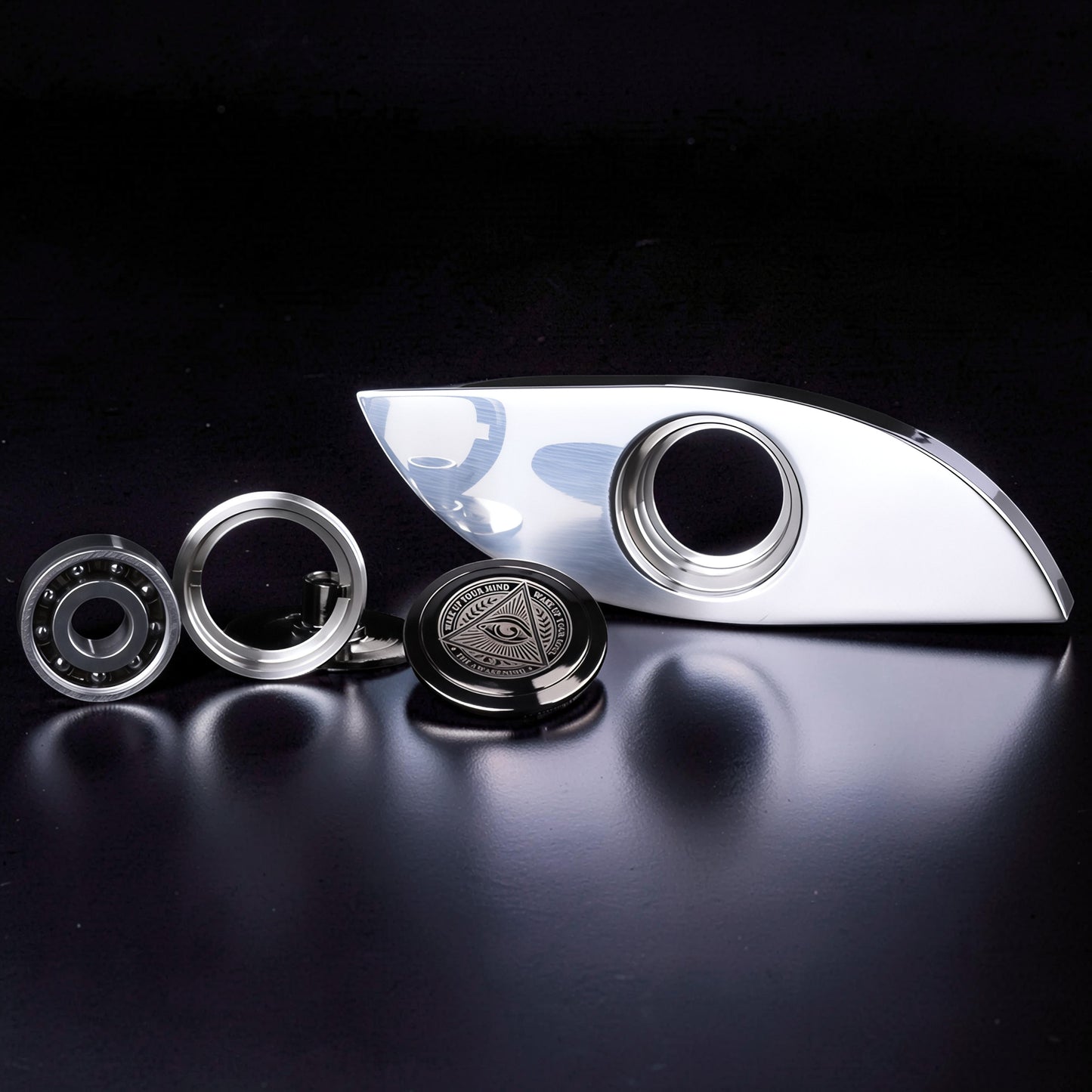 The Curious Mind Power Eye Sensory Spinner, a premium EDC metal fidget spinner with a polished silver finish and an all-seeing eye emblem.