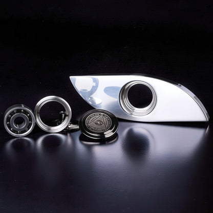 The Curious Mind Power Eye Sensory Spinner, a premium EDC metal fidget spinner with a polished silver finish and an all-seeing eye emblem.