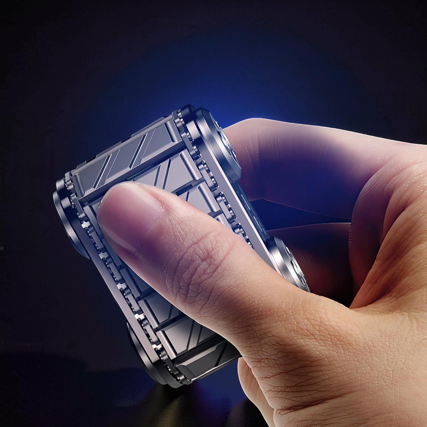 The Curious Mind Metal Tank Spinner, a tactical fidget toy with a detailed metallic design, held in hand.
