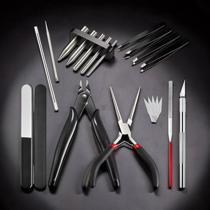 The Curious Mind Precision Model Builder Toolkit includes cutters, pliers, tweezers, files, and a craft knife for hobby building and repairs.