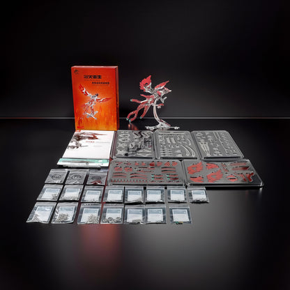 The Curious Mind Phoenix DIY Kit features silver and gold metal parts for a mechanical creature model. Includes instructions and all components for assembly.