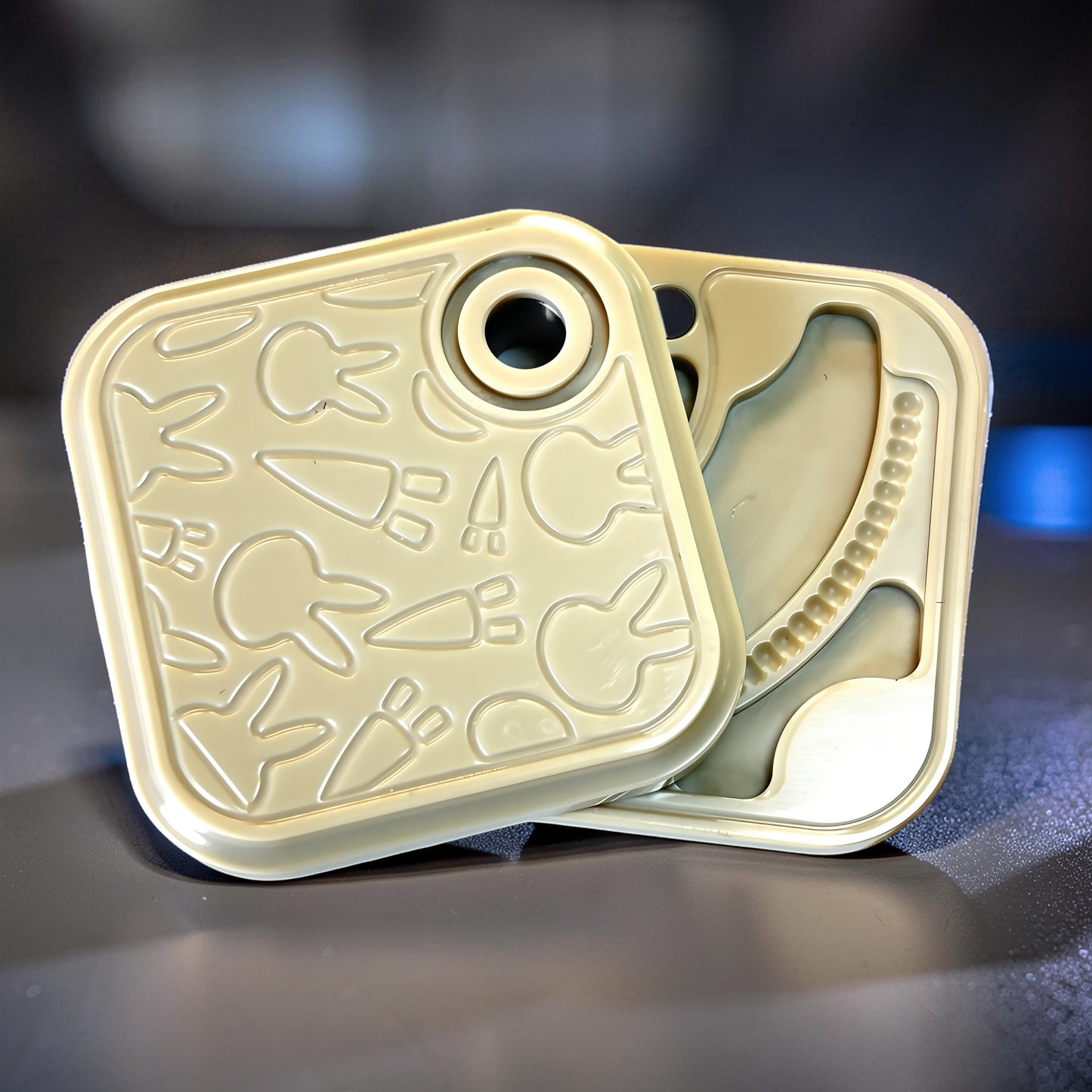 The Curious Mind Rabbit Side-Press Clicker fidget toy in light tan with embossed bunny and carrot designs. Metal construction.