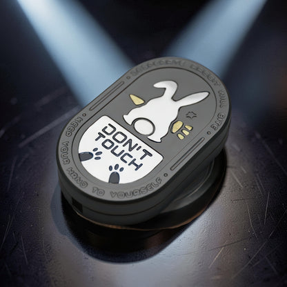 The Curious Mind Don't Touch Rabbit Slider fidget toy with a grey metal body and playful rabbit design.