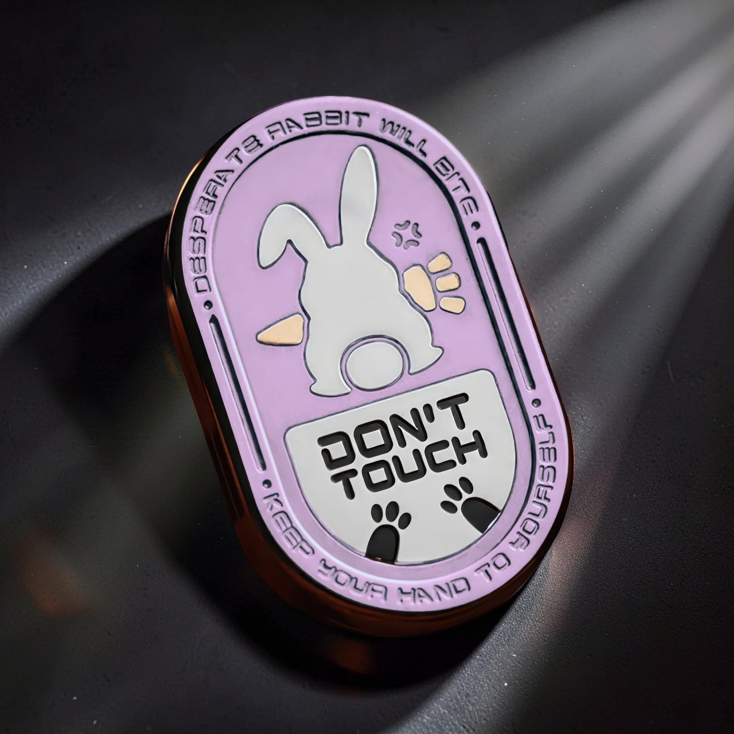 The Curious Mind Don't Touch Rabbit Slider fidget toy with a pink background, white rabbit, and warning text.