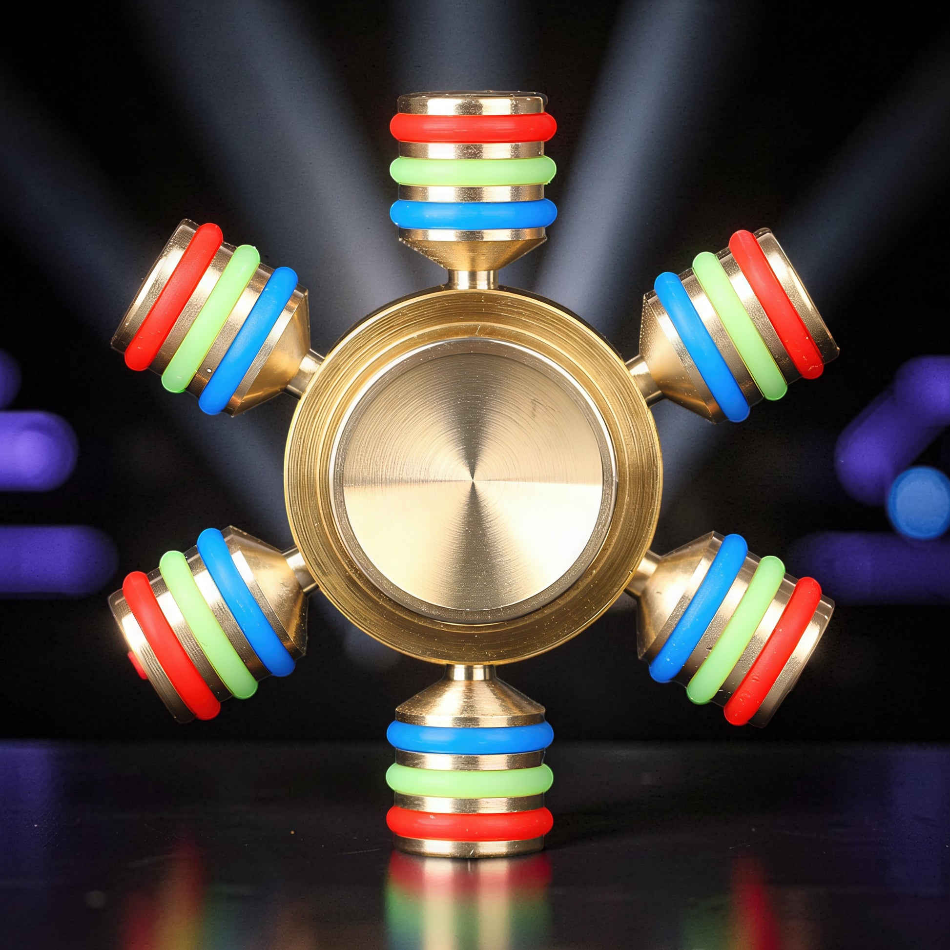 The Curious Mind Rainbow Metal Hand Spinner with red, green, and blue rings on each arm. Premium EDC fidget toy.
