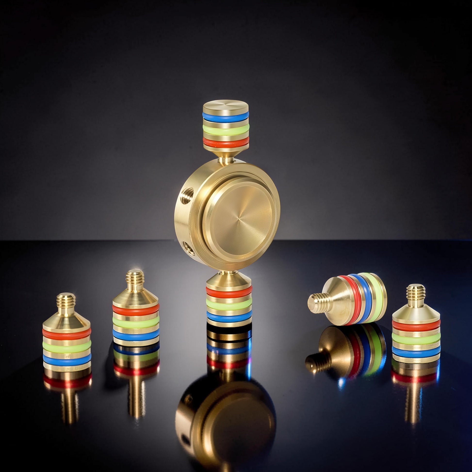 The Curious Mind premium brass hand spinner with rainbow coloured bands, perfect for EDC and fidgeting.