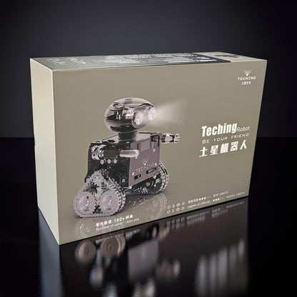 The Curious Mind RC Tank Robot DIY Kit features a black mecha robot with tank tracks and LED eyes, ready for Bluetooth assembly and control.