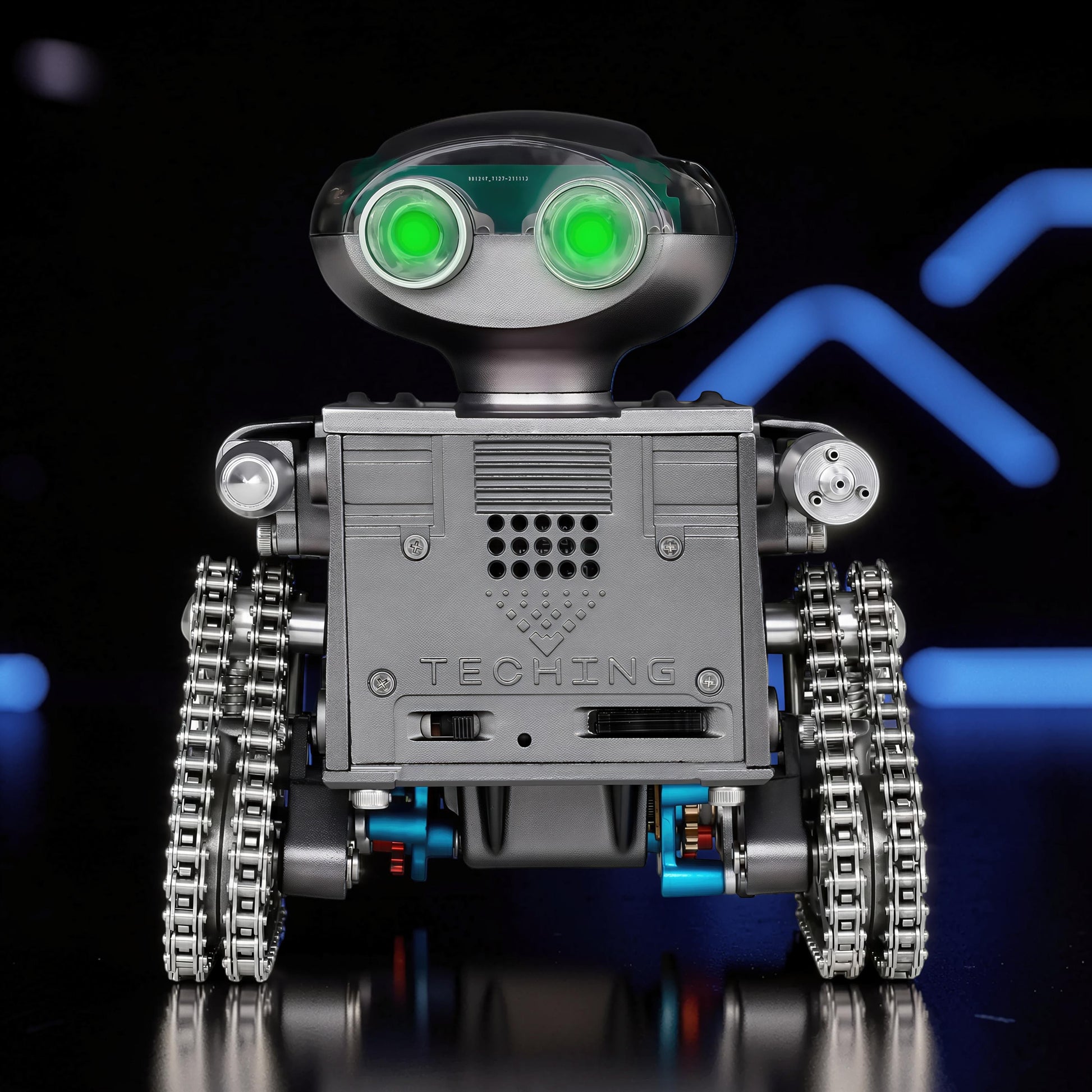 The Curious Mind RC Tank Robot DIY Kit with glowing green eyes and metal treads.