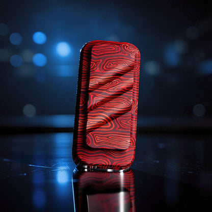 The Curious Mind Three-Layer Push Card Slider fidget toy with a red and black wood grain pattern. Compact metal design.