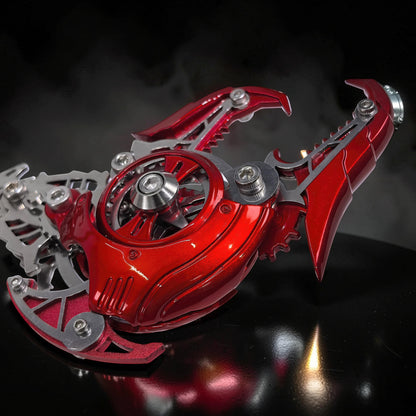 The Curious Mind's red metallic mechanical scorpion king model kit, intricate metal parts and gears.