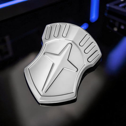 The Curious Mind Shield Fingertip Spinner, a compact EDC metal spinner with a silver shield design and star emblem.