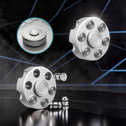 The Curious Mind silver brass finger gyro spinner with 6 bullet-shaped weights, designed like a revolver cylinder.