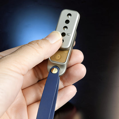 The Curious Mind Silver Buckle Card Slider fidget toy made of zinc alloy with a blue strap.
