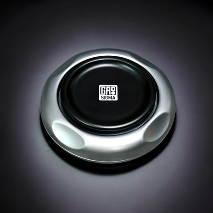 The Curious Mind Magnetic Master 2.0 spinner in silver metal with a black center featuring the GAS SIGMA logo.