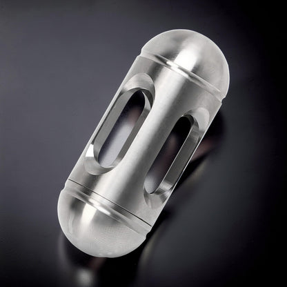 The Curious Mind silver metal egg-shaped pocket spinner with cut-out details for fidgeting and desk display.