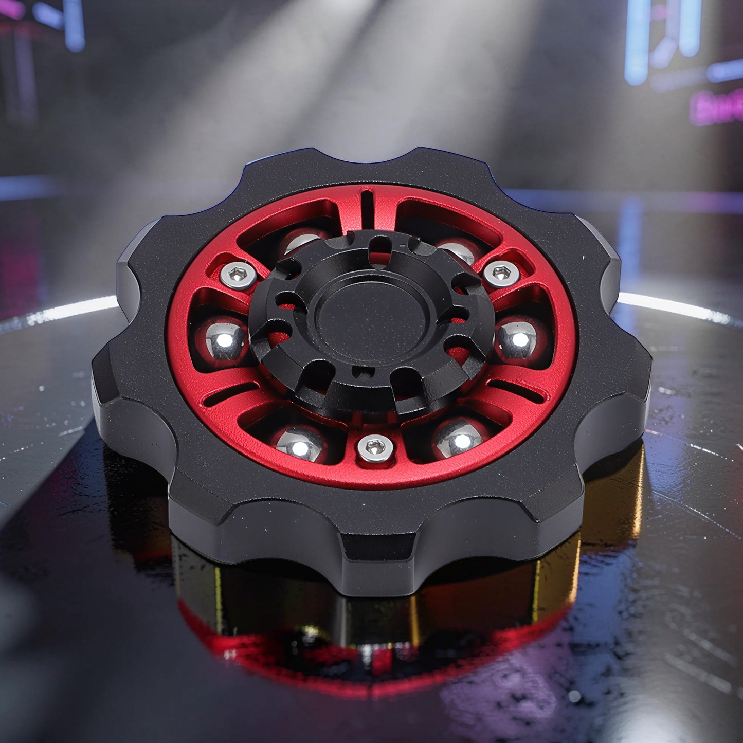 The Curious Mind Six-Bead Gear Spinner: black metal with red gear-style frame, six silver ball bearings, and central black hub.