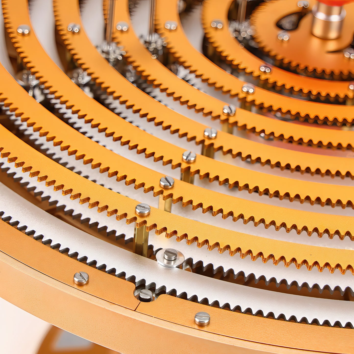 The Curious Mind Solar System DIY Kit features intricate metal gears in gold and silver, forming concentric rings for a STEM display model.