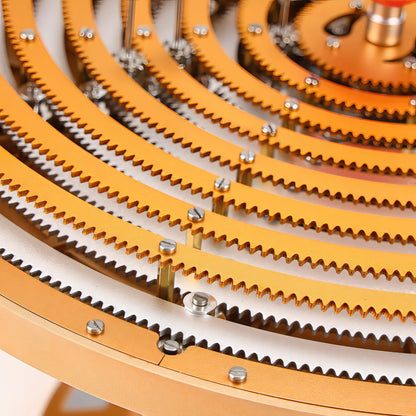 The Curious Mind Solar System DIY Kit features intricate metal gears in gold and silver, forming concentric rings for a STEM display model.