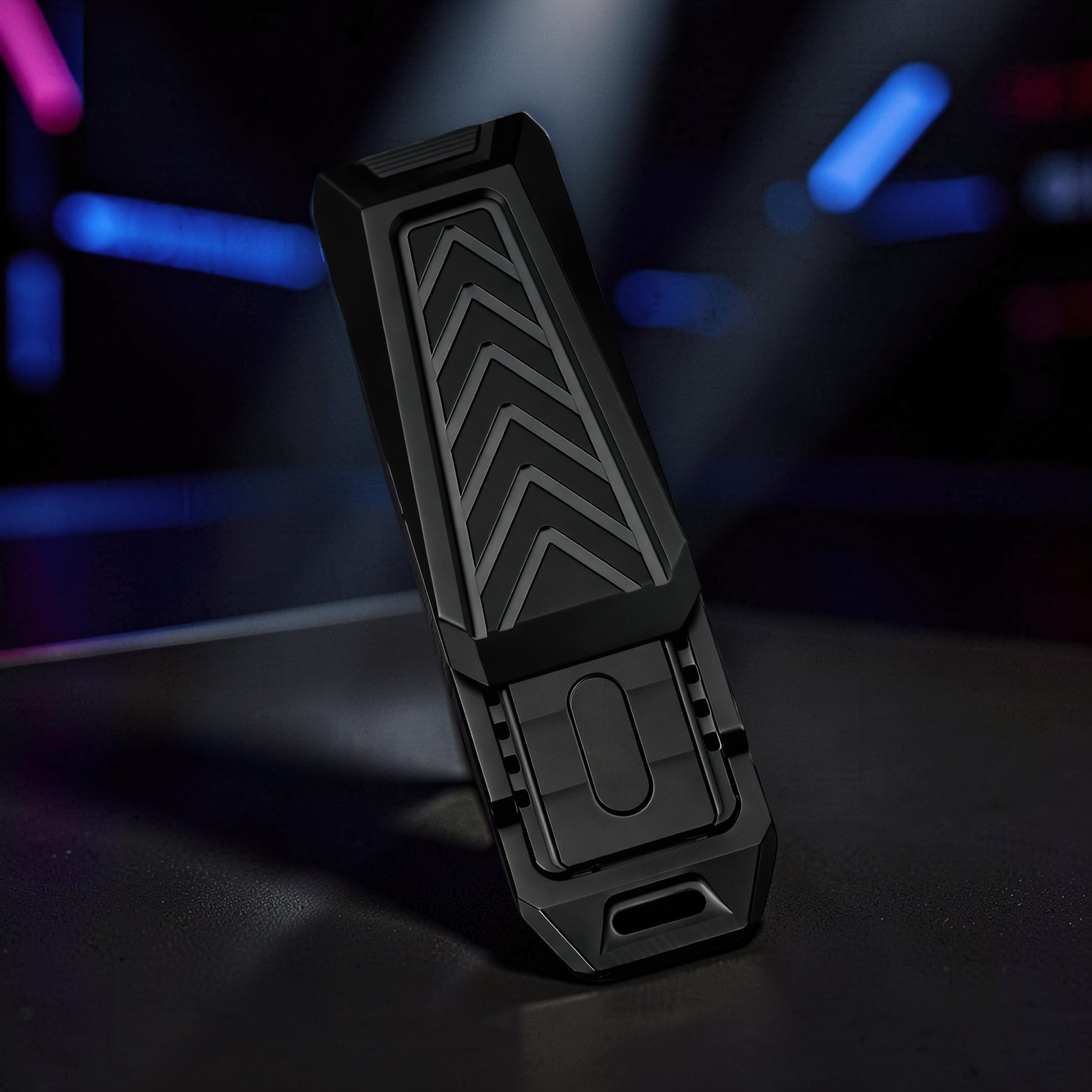 The Curious Mind Stainless Steel Chevron Slider fidget toy with a black chevron pattern and tactile slider.