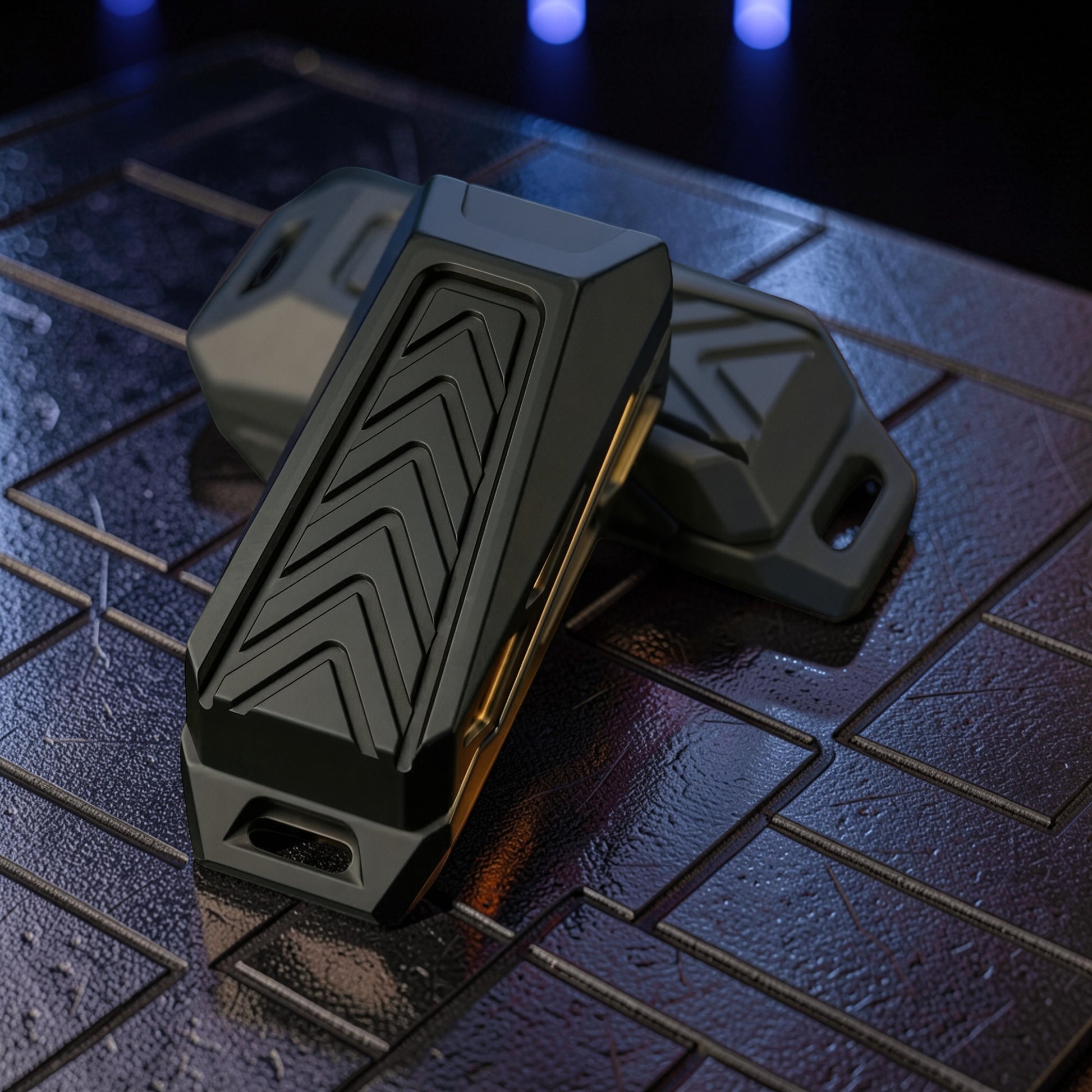 The Curious Mind Stainless Steel Chevron Slider fidget toy with a black chevron pattern and gold accents. Compact and metal.
