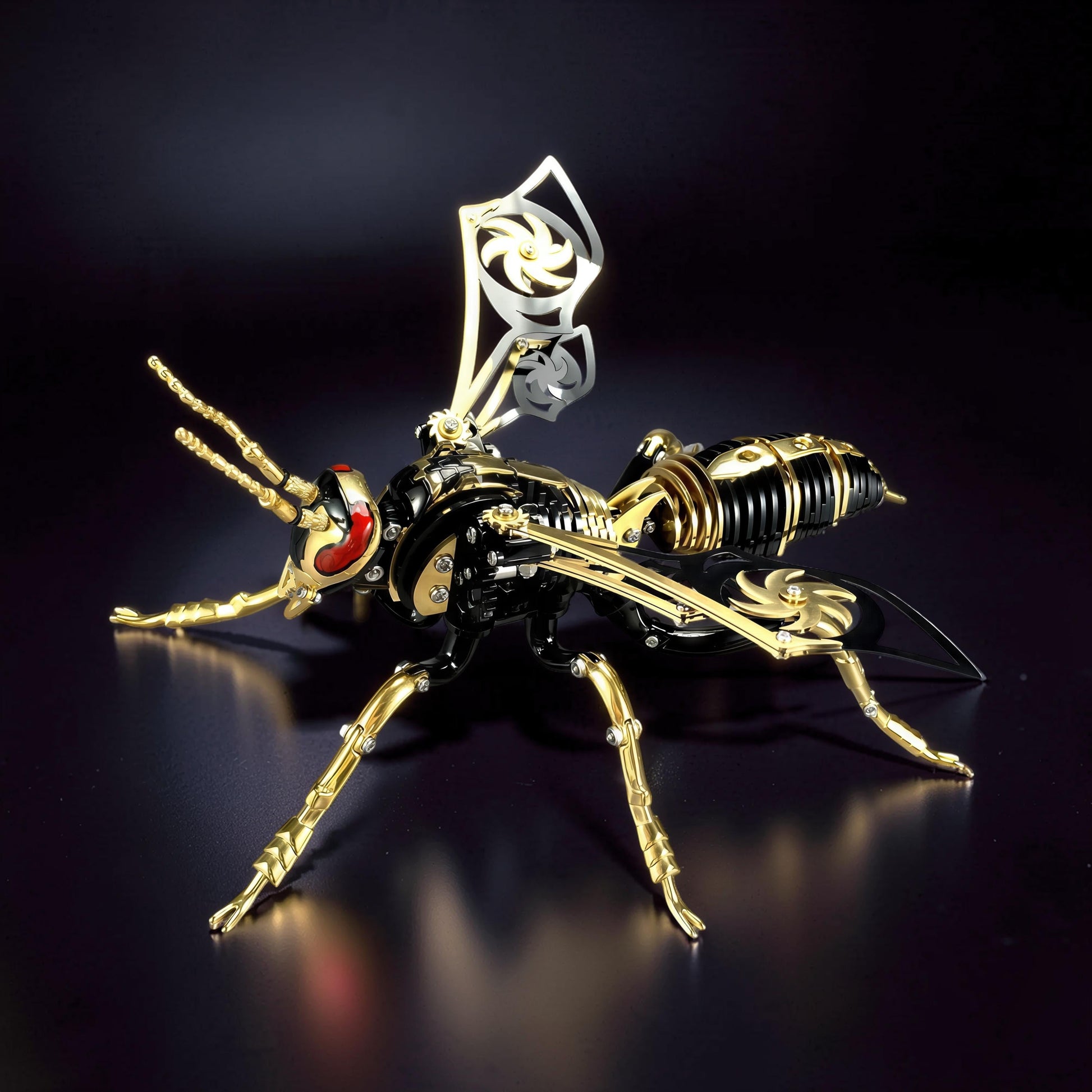 The Curious Mind Stainless Wasp 3D metal model kit, black and gold with red eyes, intricate mechanical design.