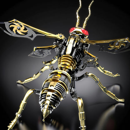 The Curious Mind Stainless Wasp 3D metal model kit, featuring gold and black metallic finishes, intricate mechanical details, and red eyes.