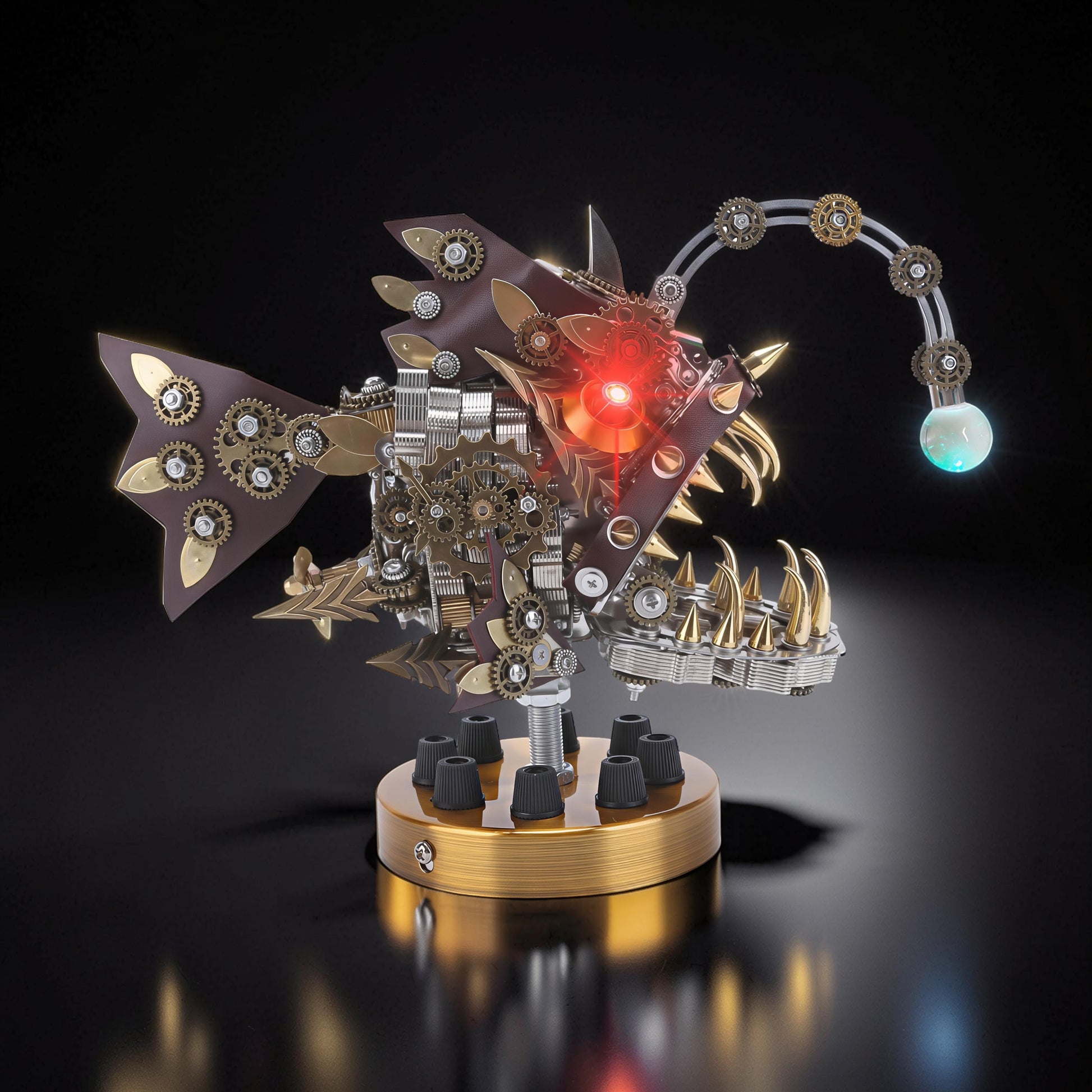 The Curious Mind Steampunk Anglerfish metal model kit with display base, featuring gears, brown leather accents, and a glowing lure.