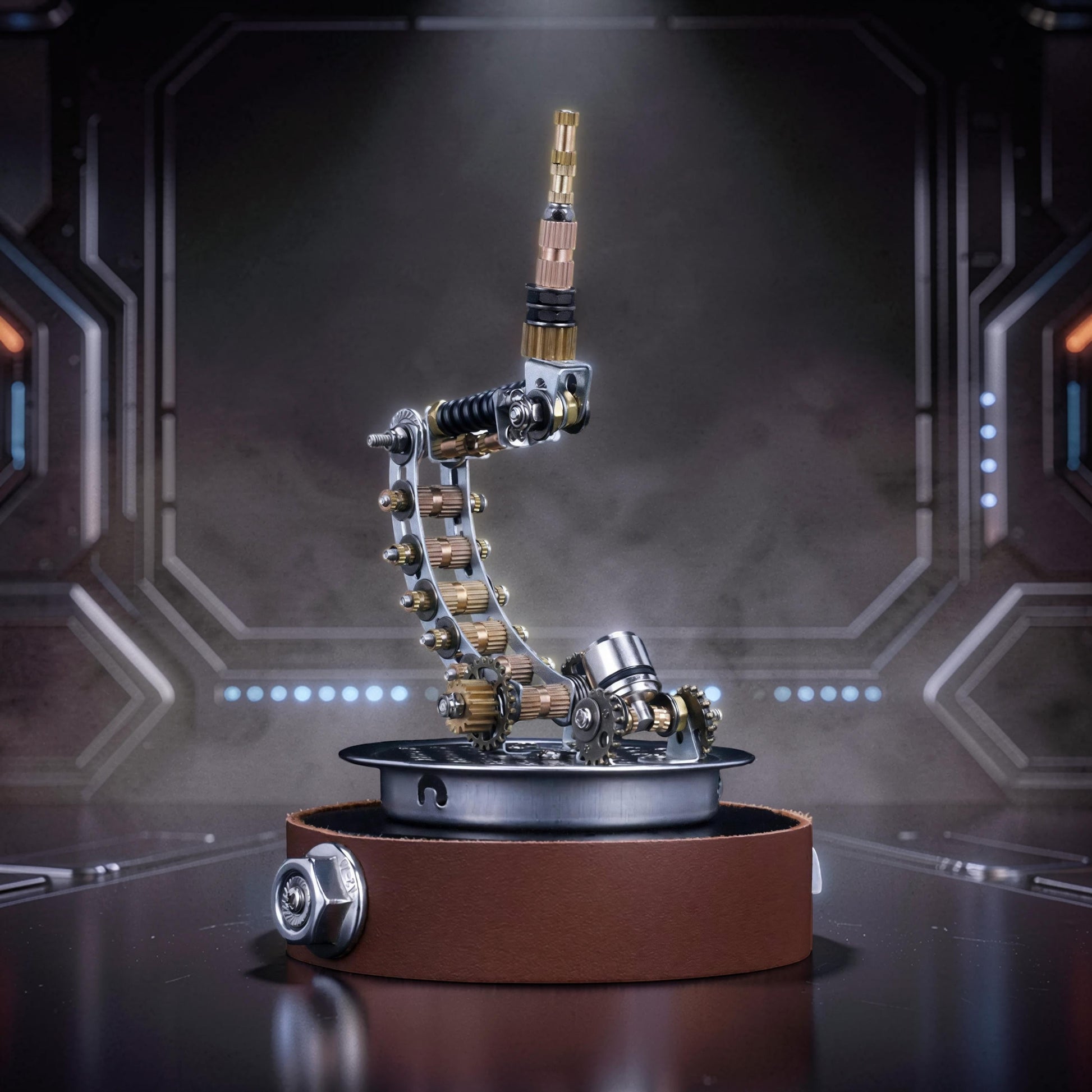 The Curious Mind metal model kit display stand with steampunk mechanical arm and brown leather base.