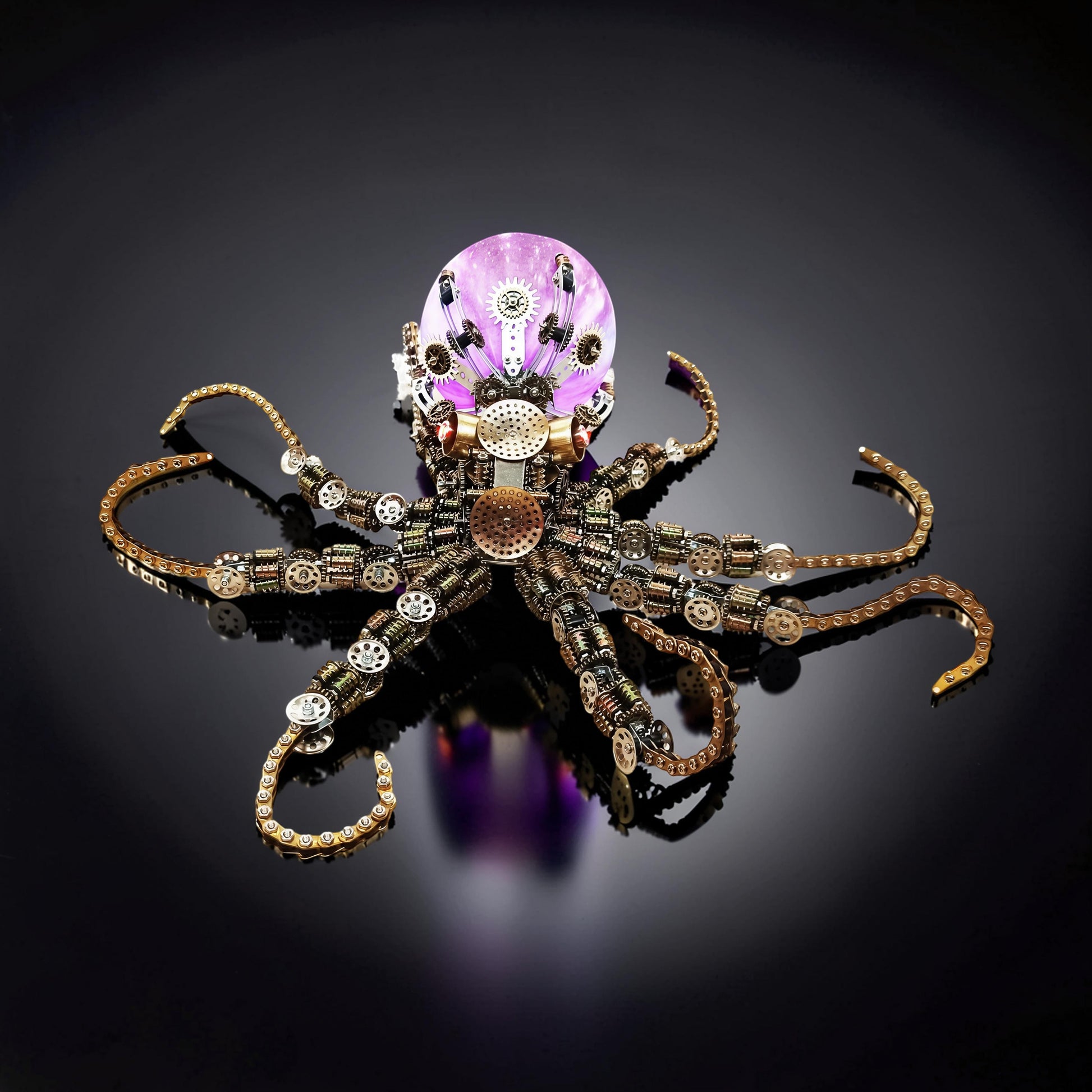 The Curious Mind Steampunk Octopus metal model kit with colourful lights and purple orb head. Intricate gears and chains form the body and tentacles.