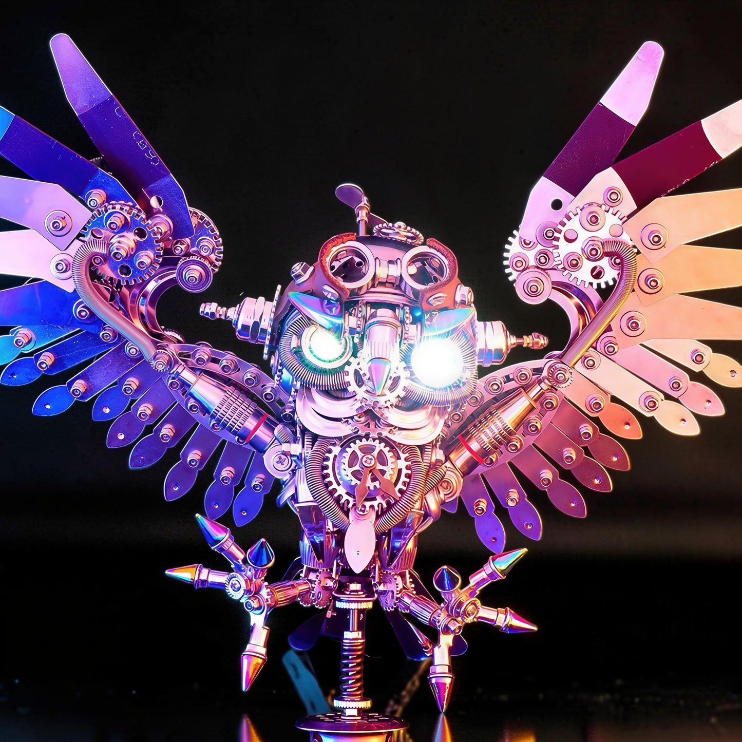 The Curious Mind Steampunk Owl 3D metal model kit with intricate gears, metallic finish, and glowing eyes. Detailed mechanical creature with outstretched wings.
