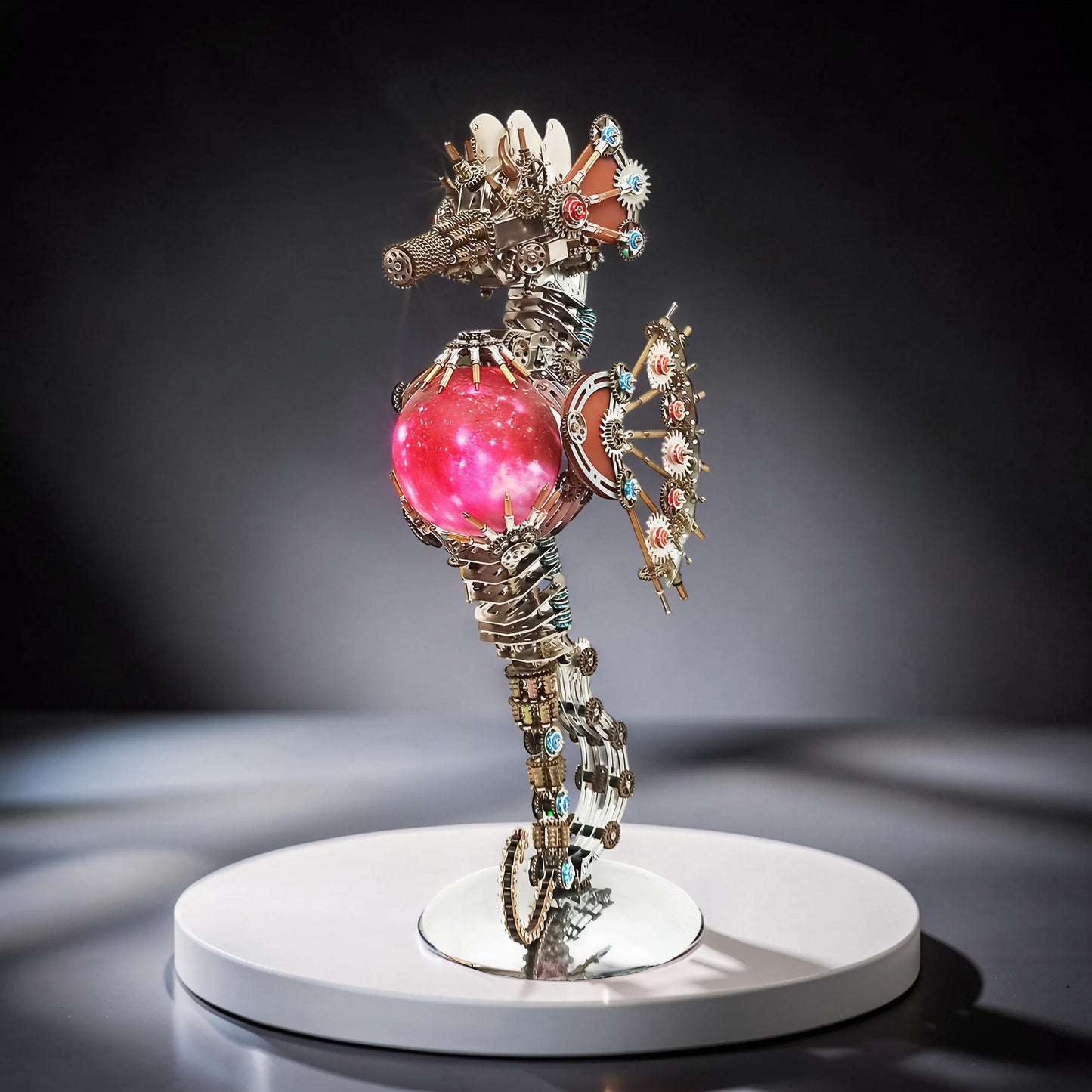 The Curious Mind Steampunk Seahorse with Lantern Light metal model kit, intricate gears, pink glowing orb, and decorative gems.