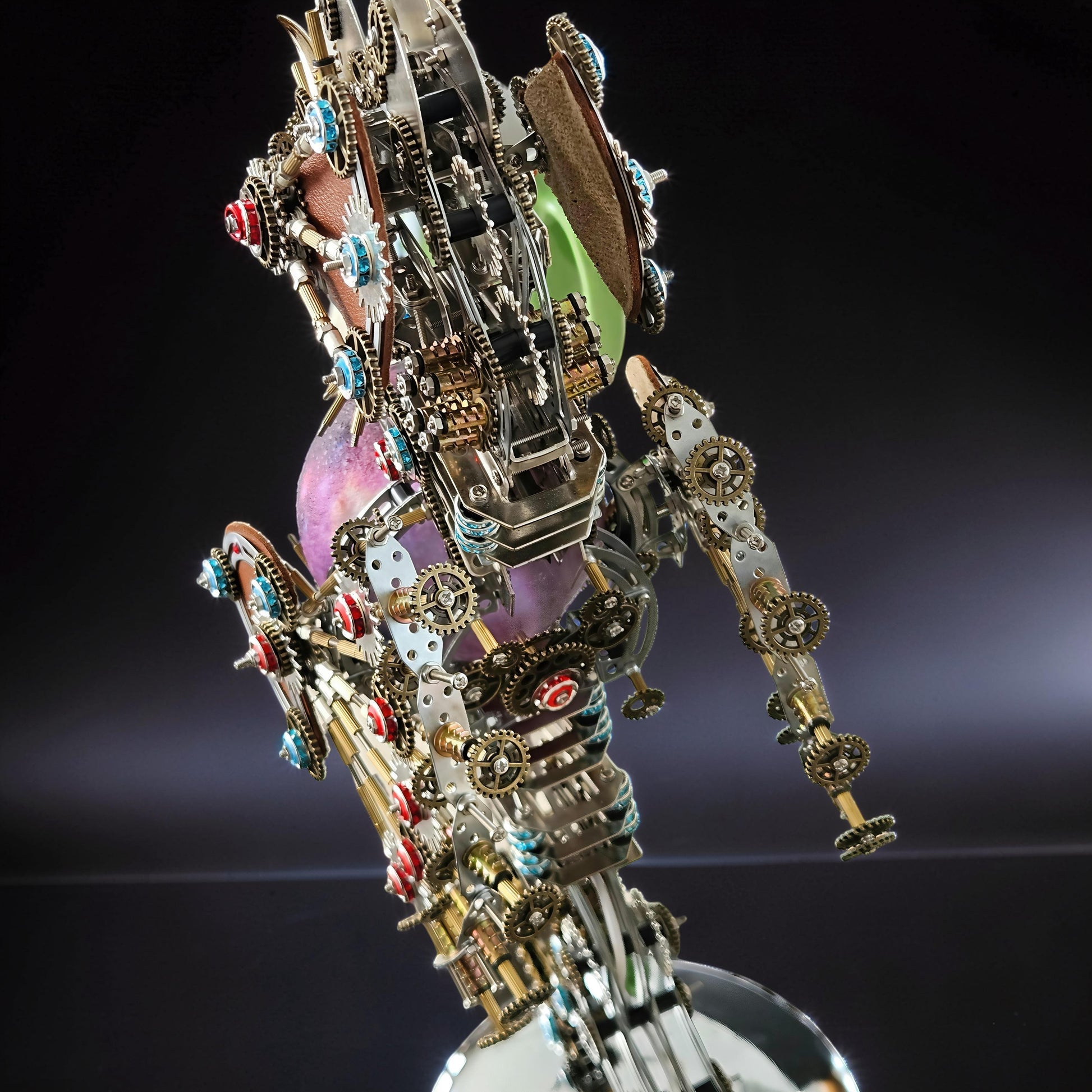 The Curious Mind Steampunk Seahorse 3D metal model kit with intricate gears, colorful gems, and a glowing lantern.