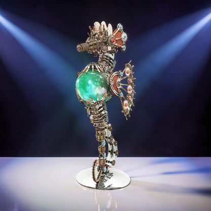 The Curious Mind Steampunk Seahorse model kit with a glowing green orb and intricate metal gears, featuring a lantern light.