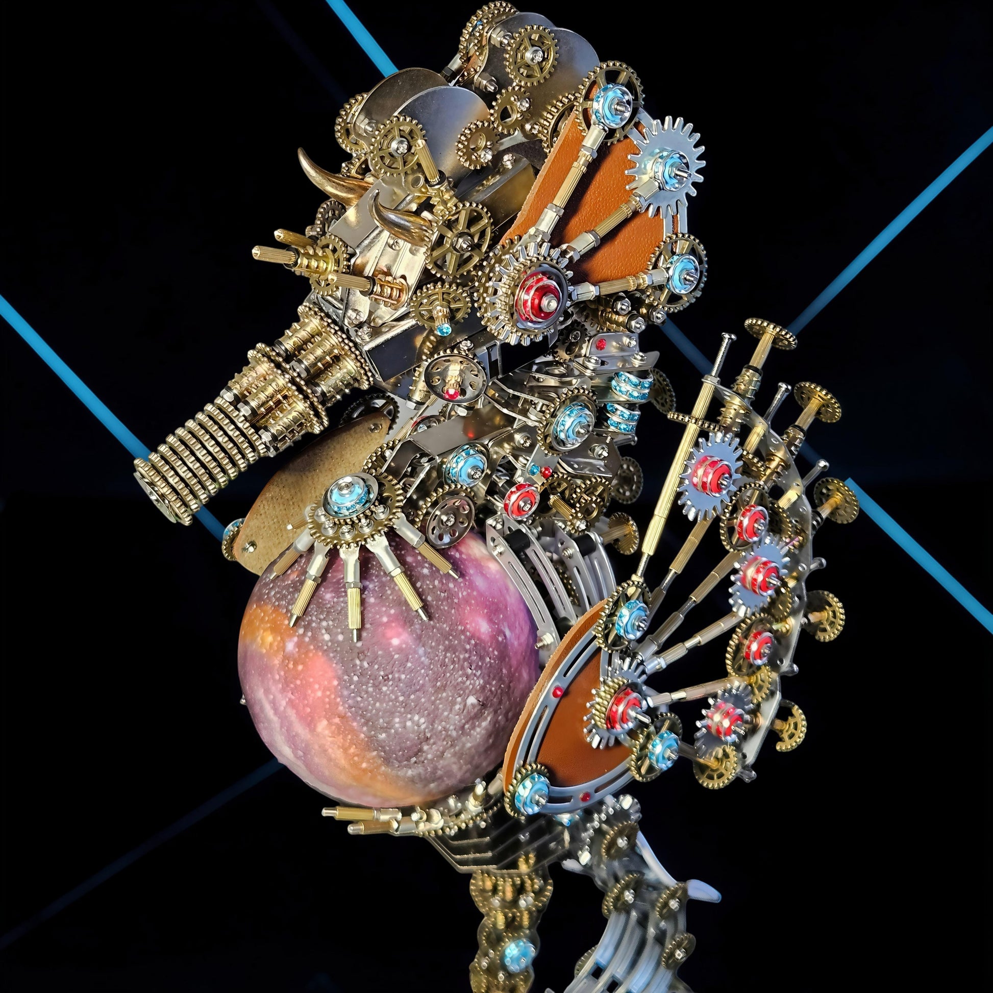 The Curious Mind Steampunk Seahorse metal model kit with a purple, speckled sphere and illuminated lantern. Intricate gears, pipes, and blue gems adorn the metallic creature.