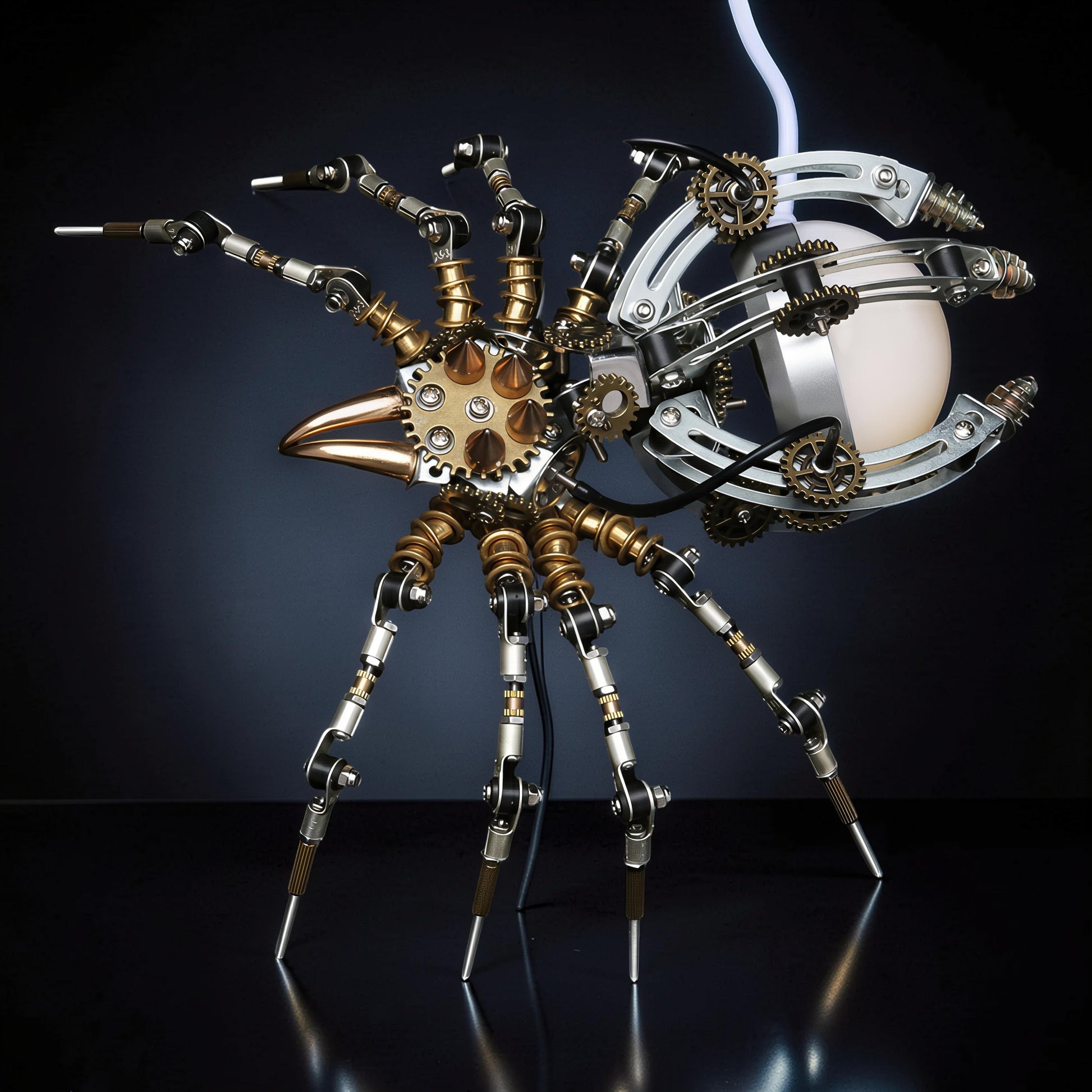 The Curious Mind Steampunk Spider Desk Lamp, a metal model kit with intricate gears, articulated legs, and a glowing orb.