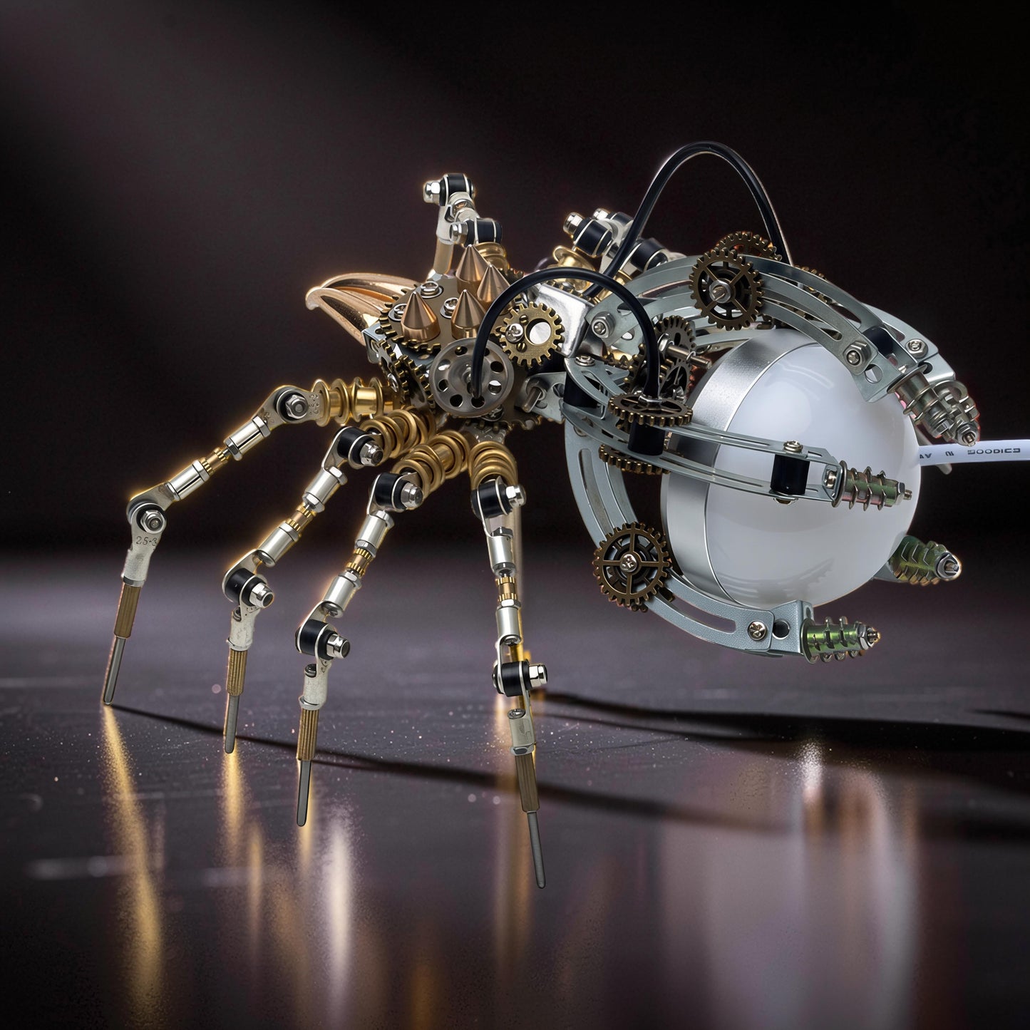 The Curious Mind Steampunk Spider Desk Lamp, a metal model kit with intricate gears and a light-up orb.
