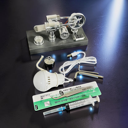 The Curious Mind mirror-polished metal Stirling engine model with voltmeter and USB, includes LED bulb, syringe, tweezers, and Allen wrench.