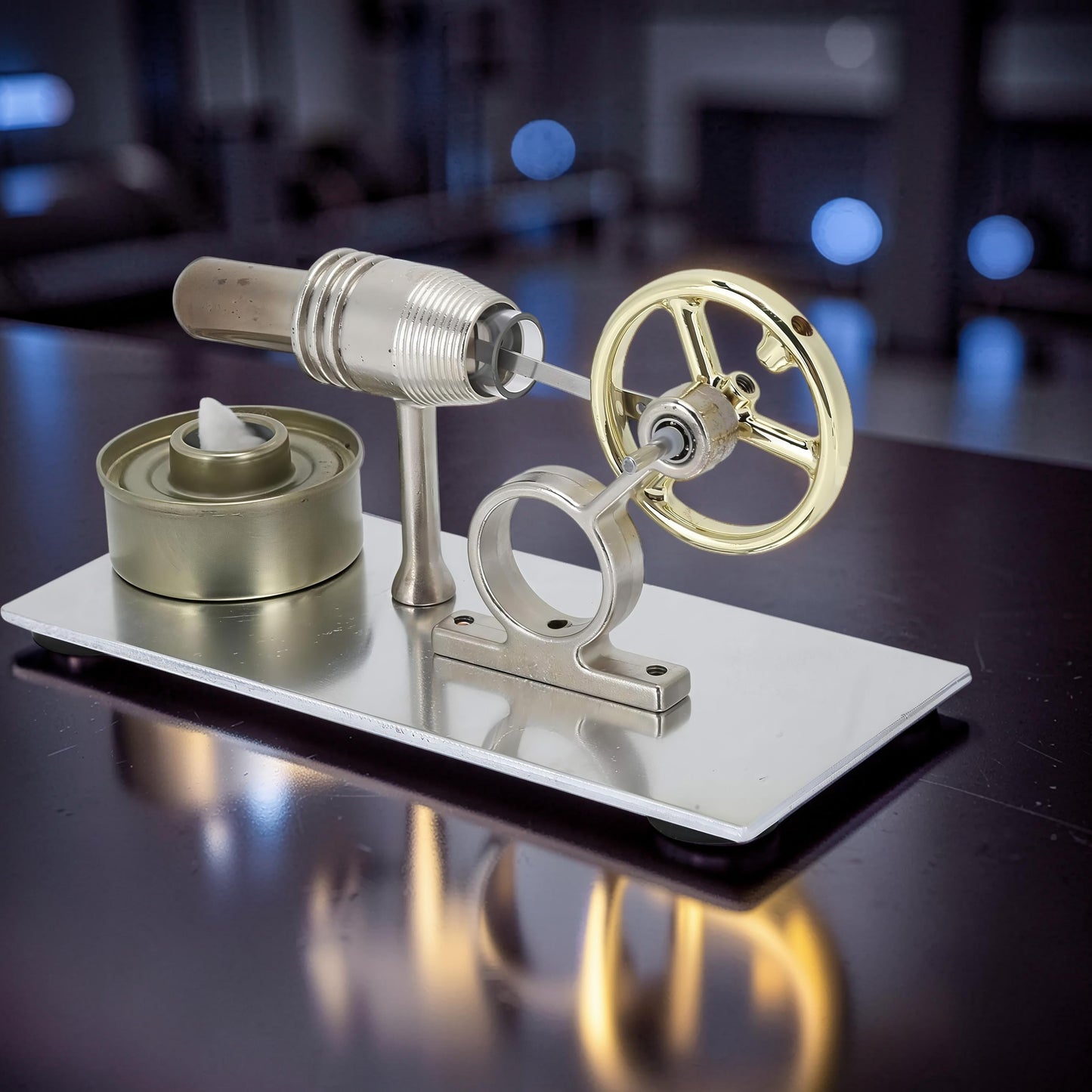 The Curious Mind Classic Stirling Engine Display, a running mechanical model with a gold flywheel and metal construction, ideal for desktop display.