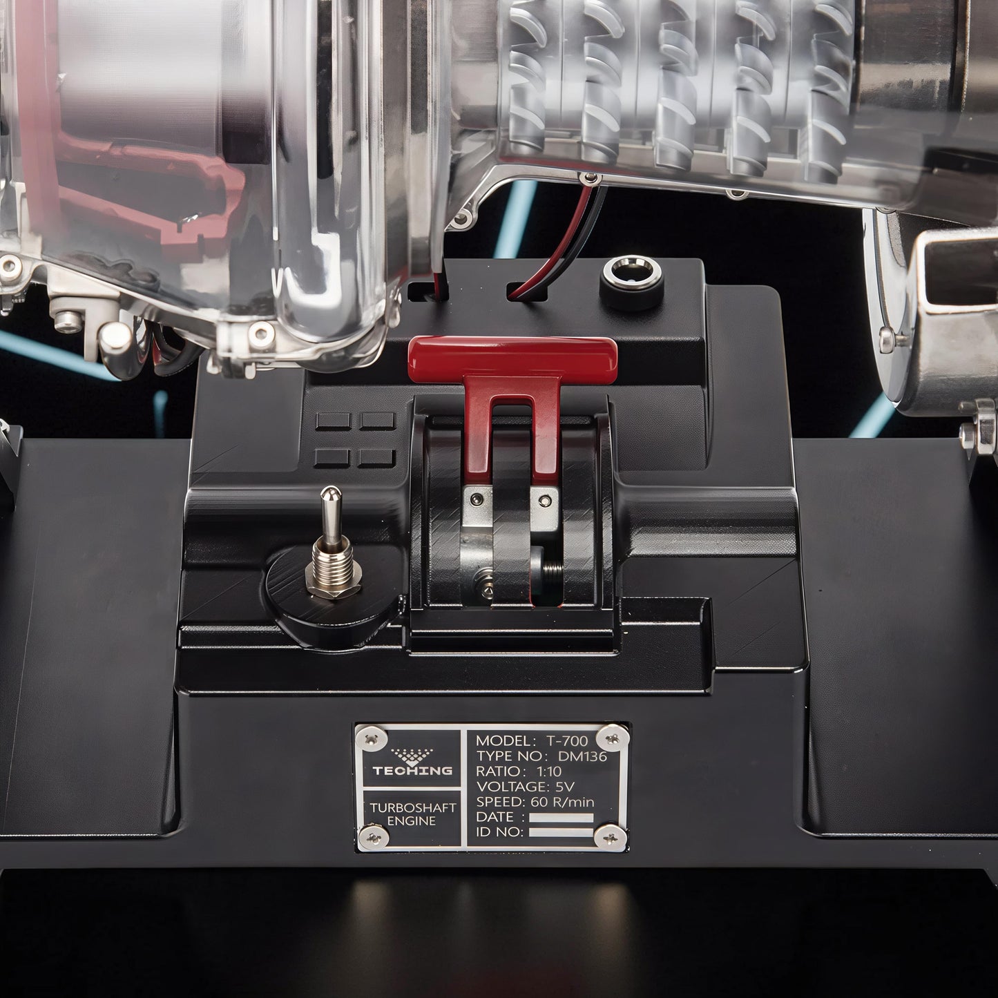 The Curious Mind T700 Turboshaft Engine DIY Kit, a detailed metal model with clear casing, red throttle lever, and switch.