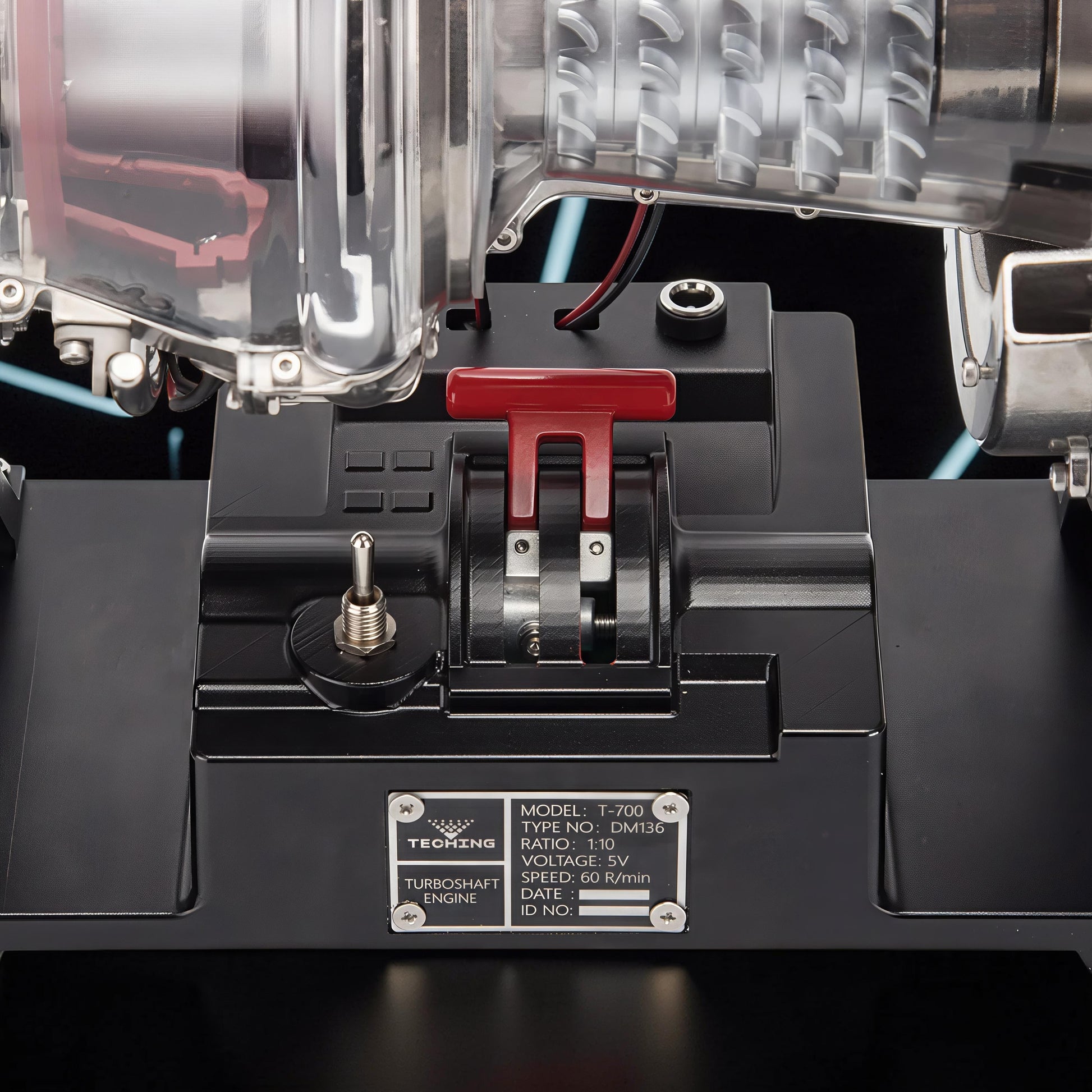 The Curious Mind T700 Turboshaft Engine DIY Kit, a detailed metal model with clear casing, red throttle lever, and switch.