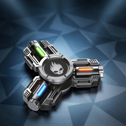The Curious Mind Tactical Tri-Blade Glow Spinner features a metallic silver body with green, orange, and blue glowing accents and a skull emblem. Its mechanical design makes it a premium EDC fidget toy.