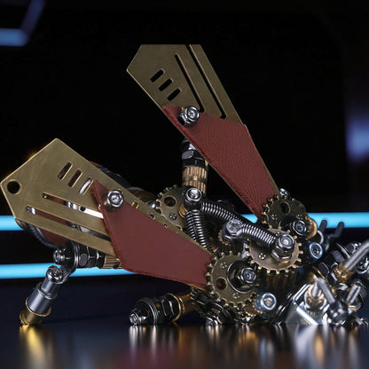 The Curious Mind Termite 3D metal model kit with brass wings, gears, and red leather accents. Steampunk mechanical insect.