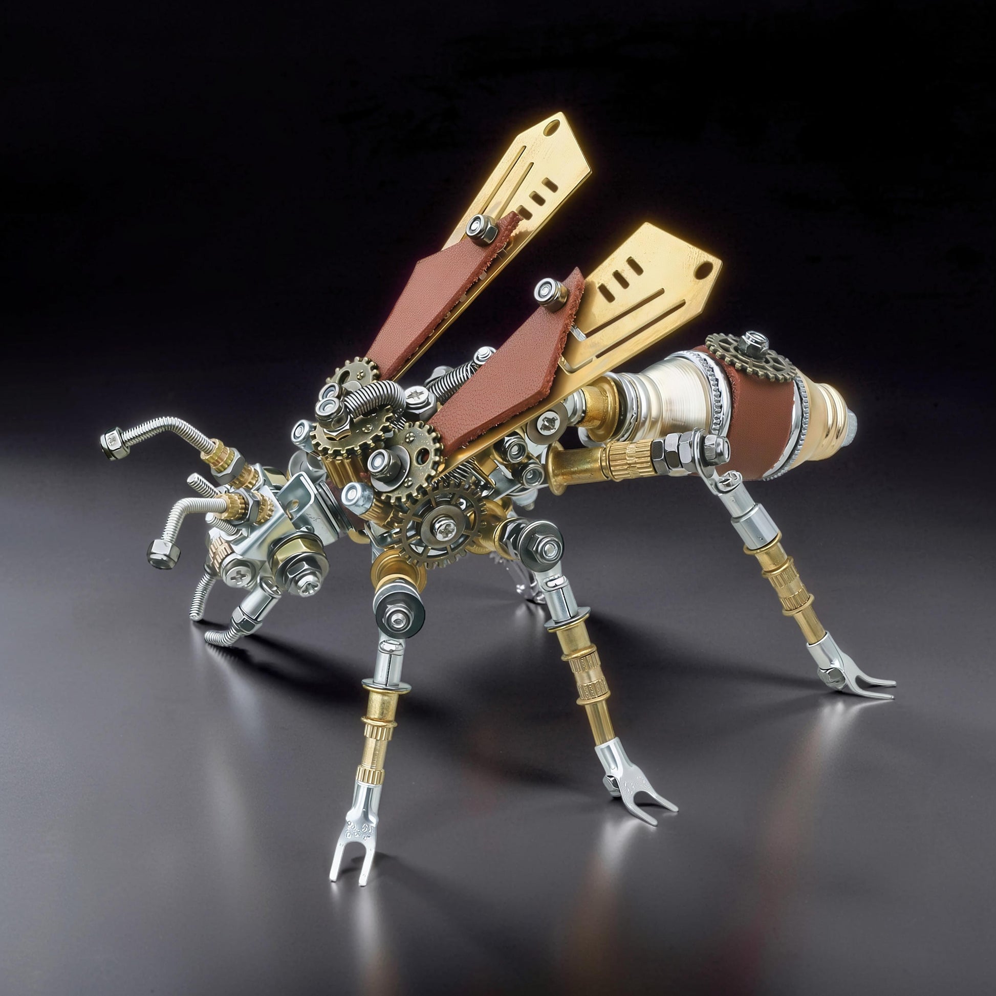 The Curious Mind Termite 3D metal model kit with brass wings, leather accents, and intricate gears. Steampunk insect sculpture.