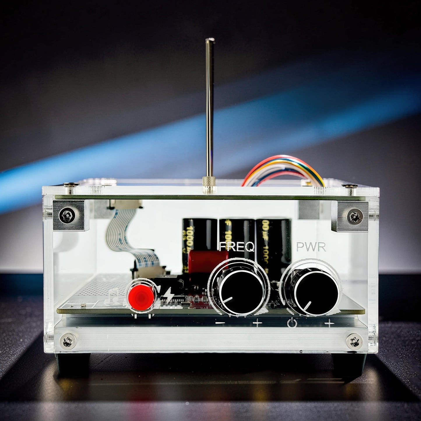 The Curious Mind Tesla Coil TC10 Plus pocket palm lightning plasma lamp with clear acrylic case, two knobs, red button, and internal components.