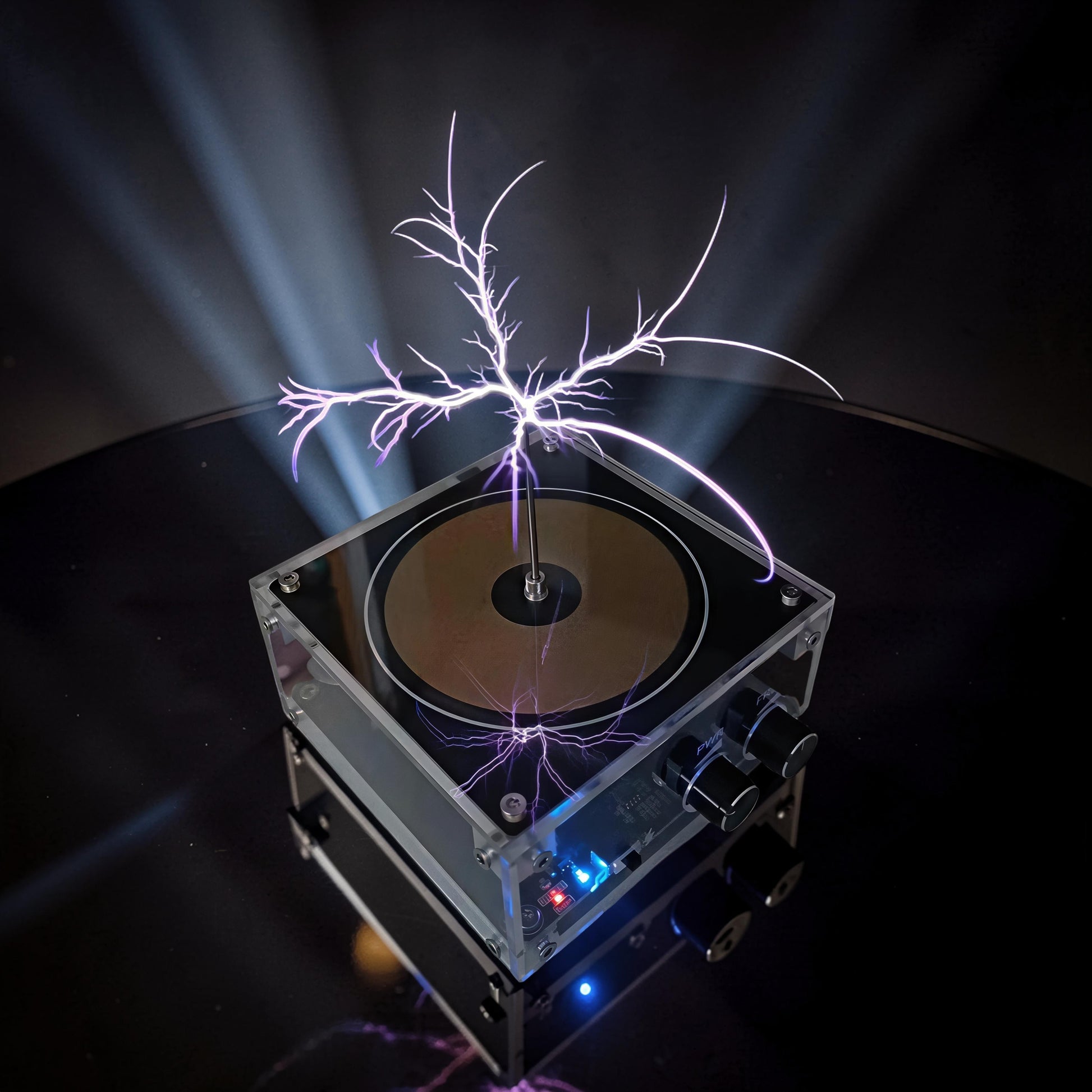 The Curious Mind Tesla Coil TC10 Plus plasma lamp with purple lightning discharges, clear acrylic casing, and black knobs.
