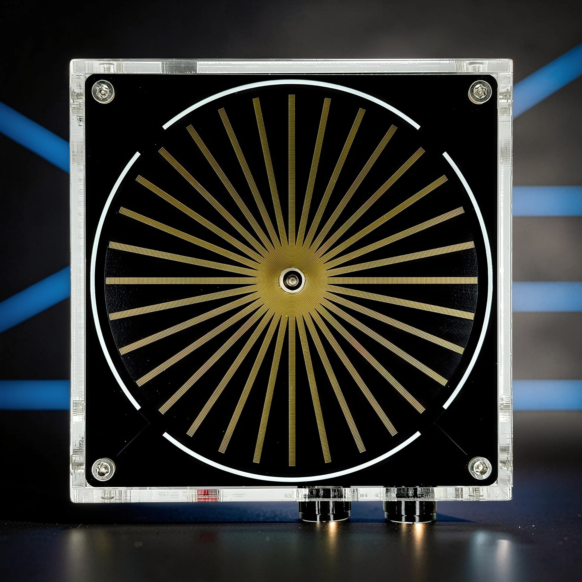 The Curious Mind Tesla Coil TC10 Plus plasma lamp with a black face, gold radial lines, and a white circular accent.