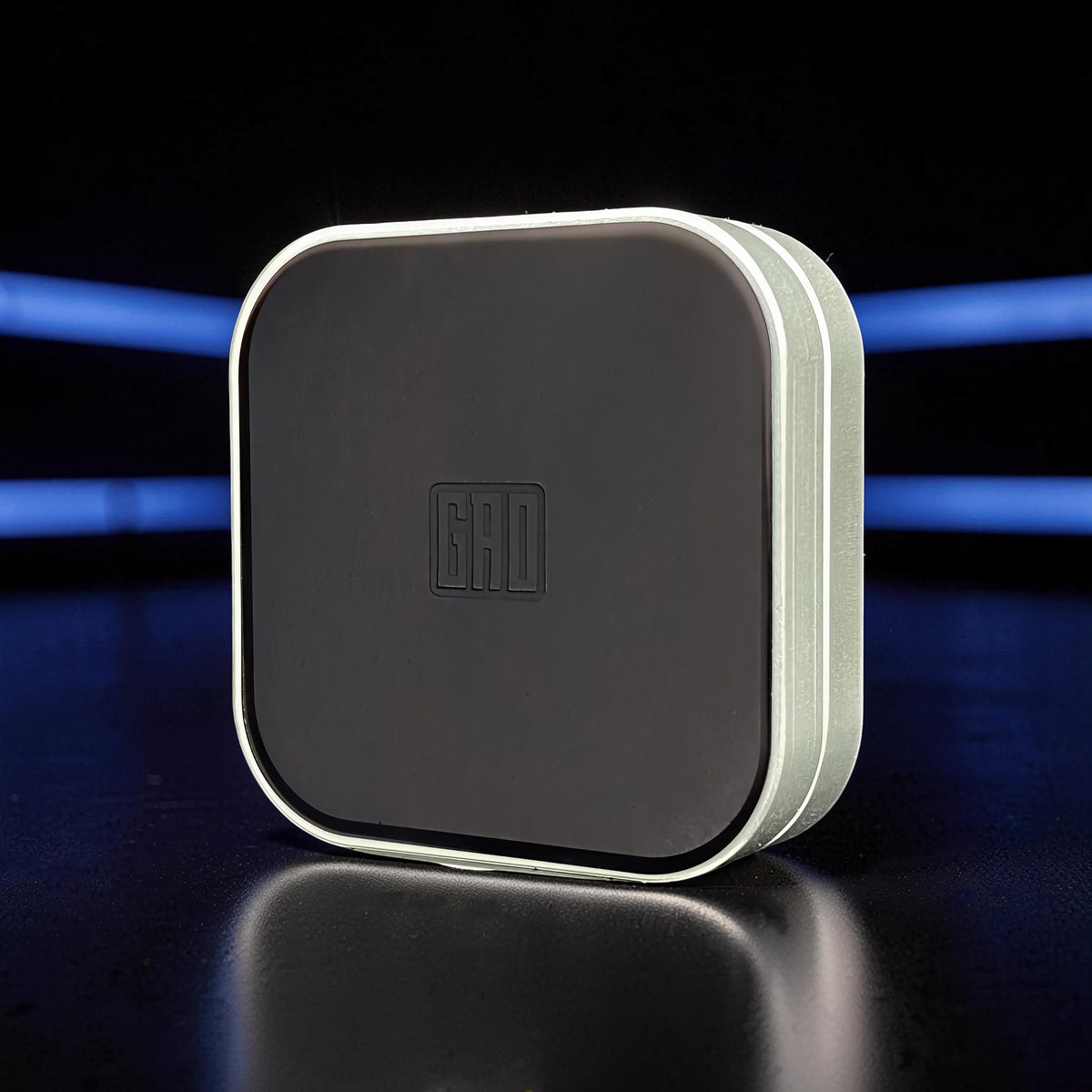 The Curious Mind Tetris Stainless Steel Slider fidget toy with a dark grey face and silver trim.