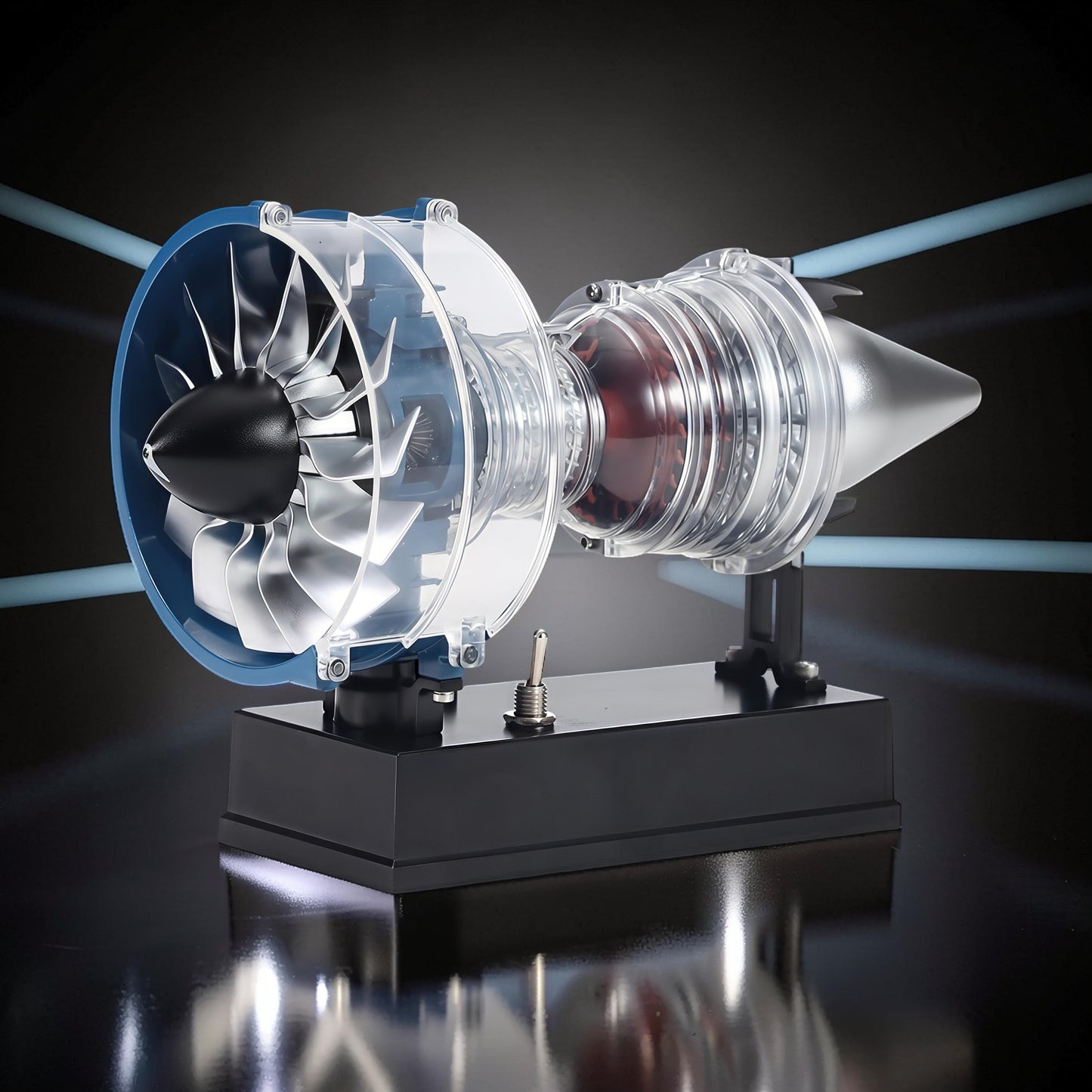 The Curious Mind Mini Turbofan Engine DIY Kit, a transparent model with blue accents and silver fan blades, displayed on a black base.
