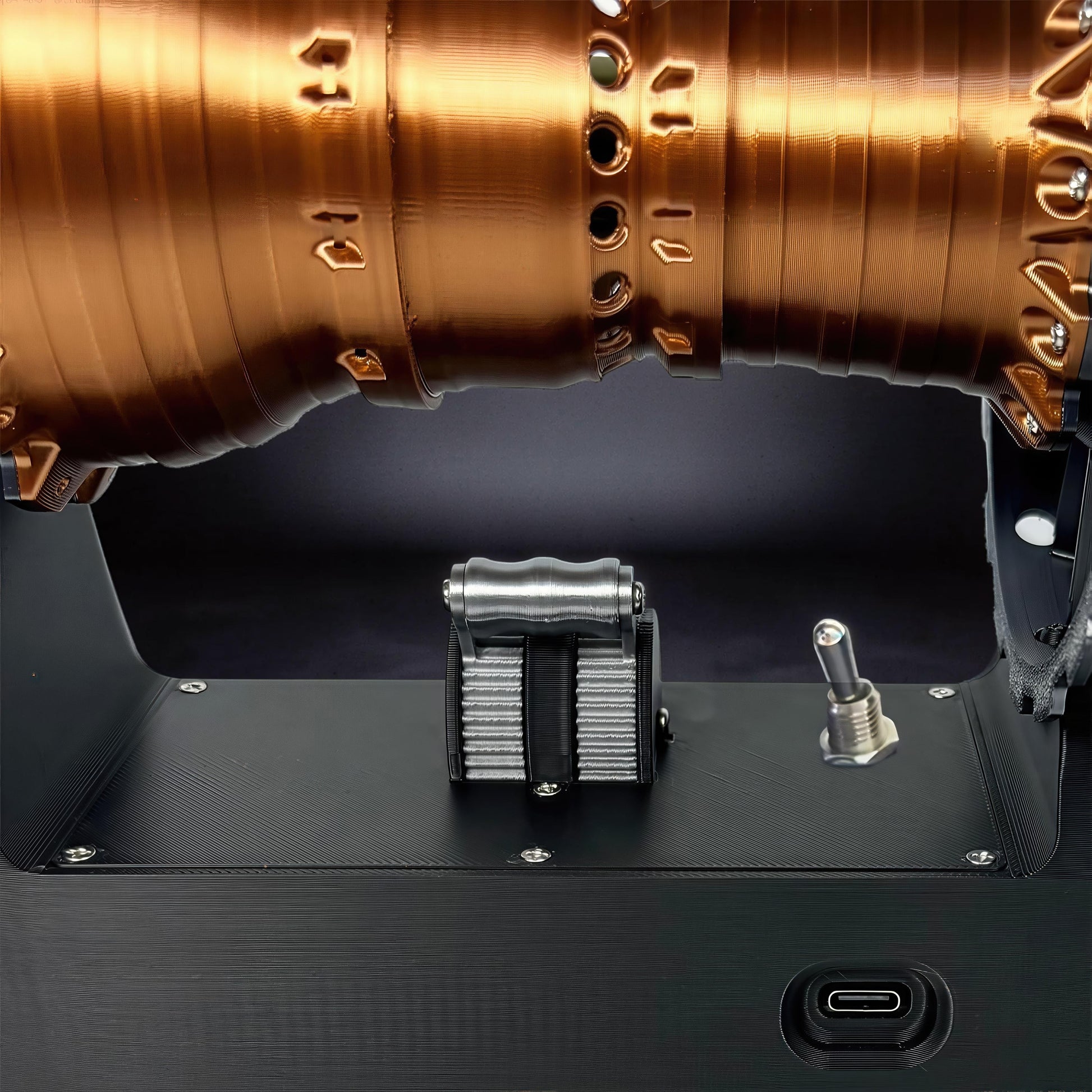 The Curious Mind TR900 Turbofan Engine DIY Kit, a detailed copper-colored model with silver throttle controls and a toggle switch.